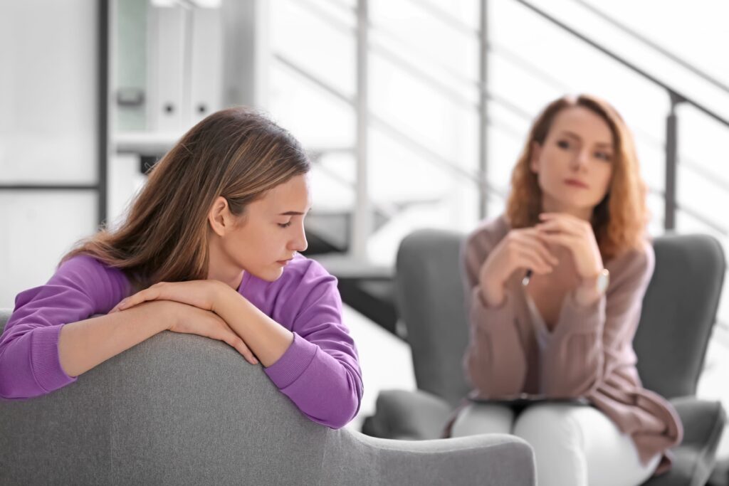 Woman discussing depression with a mental health professional